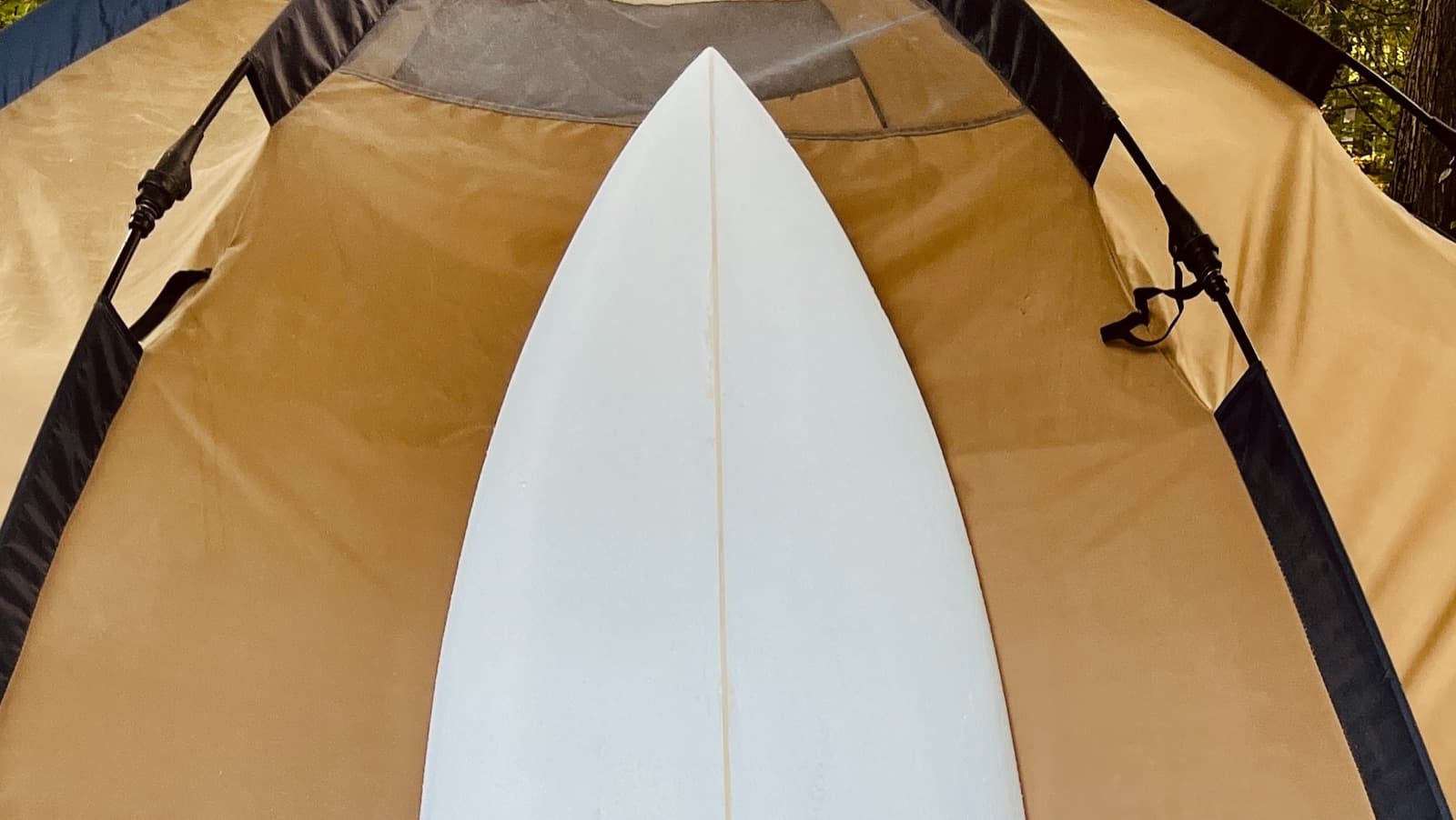 Nose of the Hurley Hybrid against a tent